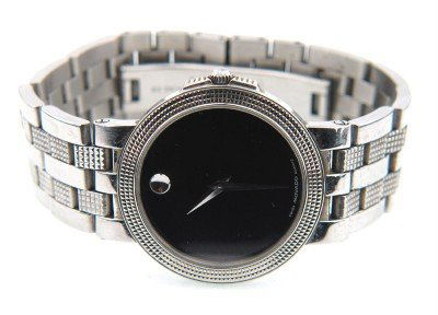 Movado Stainless Steel Watch.: Movado Stainless Steel Watch.The total watch's weight is 92.6 grams.The measurements of the watch head is 27 x 33 mm and 5 mm thick.The length of watch: 7.5".Swiss Made.Water Resistant.Chain is 18 mm