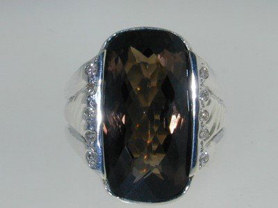 David Yurman Silver Diamond Smoky Topaz Ring: David Yurman Silver Diamond Smoky Topaz Ring.The total ring's weight is 19.0 grams.The total diamonds weight are approximately 10 pts, H-I color and VS1 clarity.The size of the Smoky Topaz is 22 x 11