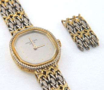 Patek Philippe 18K Two-Toned Gold Wrist Watch: Patek Philippe 18K Two - Toned ( White And Yellow) Gold Wrist Watch With Extra Link The total watch's weight is 38.8 grams. The measurements of watch head is 20 x 18 mm and 4 mm thick. The length of w