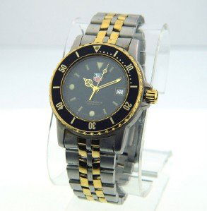 Tag Heuer 2-Toned Stainless Steel Watch.: Tag Heuer 2-Toned Stainless Steel Watch. The total watch's weight is 100.3 grams. The size of watch head: 34 x 34 mm and 8 mm thick The length of the watch is 6.5" Swiss Made Water Resistant