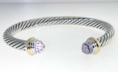 David Yurman Silver,14K Gold, Lavender Amethyst Bangle: David Yurman Silver, 14K Yellow Gold, Lavender Amethyst Bangle.The total Bangle's weight is 40.0 grams.The size of Lavender Amethyst: 6x6 mm The measurement of the inside bangle is 58x49mm, Thickness: