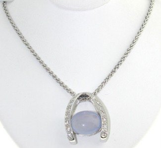 14K White Gold Chalcedony & Diamond Necklace.: 14K White Gold, Chalcedony & Diamond Necklace.The total necklace's weight is 10.2 grams.The size of the Chalcedony is 10 x 7 mm. Total diamond weight is 0.48 cts, approximately, I color, I-1 clarity.T