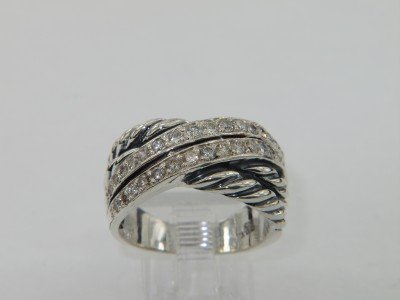 David Yurman Silver Diamond Ring: David Yurman Silver Diamond Ring.The total ring's weight is 7 grams.The total weight of the diamond is 0.63 cts approximately, I color SI clarity.The size of the ring is 7.The measurement of ring's su