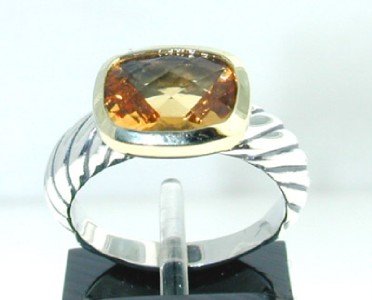 David Yurman 18k Gold/ Silver,Citrine Ring.: David Yurman 18k Gold/Silver,Citrine Ring.The total ring's weight is 5.4 grams.The size of the Citrine is 10 x 8 mm.The measurement of ring's surface is 11 x 12 mm and 5 mm thick.There is D.Y',925" 75
