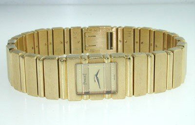 Piaget 18K Yellow Gold Watch: Piaget 18K Yellow Gold Watch.The total watch's weight is 78.7 grams.The measurements of watch head is 17 x 13 mm and 5 mm thick.The length of watch: 5".swiss made.Water Resistant.Chain is 11 mm wide