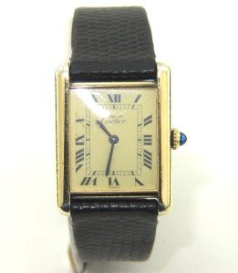 Cartier Silver Black Leather Strap watch: Cartier Silver Black Leather Strap Watch.The total watch's weight is 28.8 grams.The measurement of watch head is 22 x 22 mm and 5 mm thick.Circular-grained crown set with a spinel cabochon.The length 