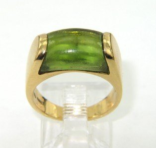 Bvlgari 18K Yellow Gold Cabochon Peridot Ring: Bvlgari 18K Yellow Gold Cabochon Peridot Ring.The total ring's weight is 7.1 grams.The measurement of cabochon peridot: 11 x 7 mm.The size of ring: 4.5 and 5 mm wide