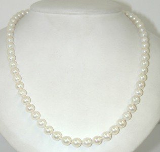 Mikimoto 18K White Gold Pearl Necklace: Mikimoto 18K White Gold Pearl Necklace with Guarantee Certificate and Box. The weight of the necklace is 29.3 grams. The necklace is 17" long. The size of pearl: 6 mm, graduated.