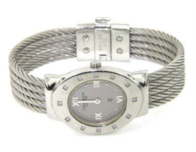 Charriol Stainless Steel Diamond Bangle Watch: Charriol Stainless Steel Diamond Bangle Watch. watch's Weight: 46 grams. The total weight of diamond: 0.24 cts. I color SI clarity. The measurement of watch head: 27 x 22 mm and 5 mm in thickness. The