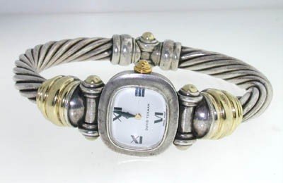 David Yurman 14K Yellow Gold and Silver Watch: David Yurman 14K Yellow Gold and Silver Watch.watch's Weight :54.2 grams.The measurements of the Inside watch's Bangle is 62x50mm and the thickness is 7 mm.