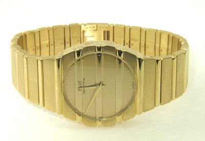 Piaget 18K Yellow Gold Watch: Piaget 18K Yellow Gold Watch The total watch's weight is 114.2 grams. The measurements of watch head is 23 x 28 mm and 4 mm thick. The length of watch: 6.75" swiss made Water Resistant Chain is 15 mm