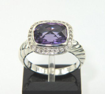 David Yurman Silver, Amethyst & Diamond Ring: David Yurman Silver Amethyst & Diamond Ring. The total ring's weight is 4.7 grams. The total weight of the diamond is 0.24 cts approximately, I color SI clarity. The size of the amethyst is 10 x 8 mm.