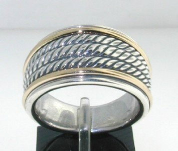 David Yurman Silver, 18K Yellow Gold Ring: David Yurman Silver,18K Yellow Gold Ring. The total ring's weight is 14.4 grams. The size of the ring is 7