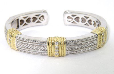 Judith Ripka Silver/18K Yellow Gold Diamond Bangle: Judith Ripka Silver/18K Yellow Gold Diamond Bangle With Pouch.The total weight of Bangle is 44.4 grams.The total weight of diamond is 0.54 cts. approximately, H color VS clarity.The size of Bangle is 