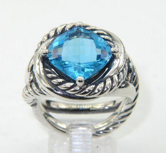 David Yurman Silver Blue Topaz Ring.: David Yurman Silver Blue Topaz Ring. The total ring's weight is 12.4 grams. The size of Blue Topaz is 10 x 10 mm. The size of the ring is 7 The measurement of the face of the ring is 16 x 16 mm. Thick