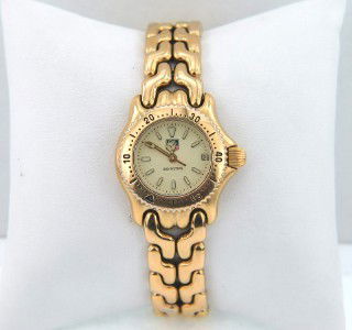 Tag Heuer Stainless Steel DateJust Watch: Tag Heuer Stainless Steel DateJust Watch.The total watch's weight is 50.7 grams.The size of watch head: 21 x 23 mm and 6 mm thick.The length of the watch is 7".Swiss Made.Water Resistant.Chain is 11 m