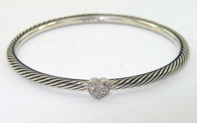 David Yurman Silver Diamond Bangle: David Yurman Silver Diamond Bangle.The total Bangle 's weight is 11.4 grams.The total diamond weight is 0.10 cts approxmiately. I color SI clarity.The bangle size is 49 x 47 mm. 2 mm in thickness.