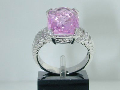 14K White Gold Pink Topaz Diamond Ring.: 14K White Gold Pink Topaz & Diamond Ring.The total ring's weight is 7.7 grams.The total weight of the diamond is 25 pts. approxmiately, H color VS clarity.The total weight of the Pink Topaz is 10 cts