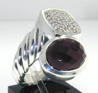 David Yurman Silver Garnet Diamond Ring: This is a Wonderful David Yurman Silver Garnet Diamond Ring.The total ring's weight is 13.1 grams.The total diamond weight is 0.5 ct ,approxmiately. H color VS clarity.The size of Garnetis 12x10 mm.Th