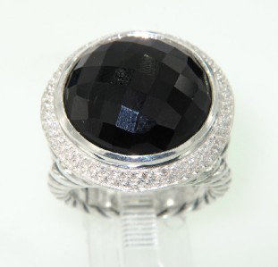 David Yurman Silver, Onyx & Diamond Ring.: David Yurman Silver, Onyx & Diamond Ring.The total ring's weight is 17.6 grams.The total weight of the diamond is 0.79 cts approximately, I color SI clarity.The size of the onyx is 16 mm.The size of t