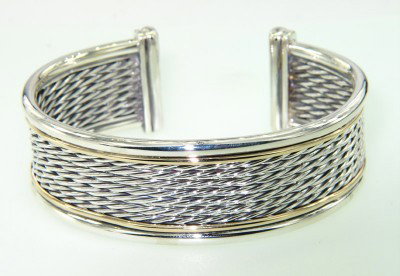 David Yurman 18K Yellow Gold & Silver Bangle: David Yurman 18K Yellow Gold & Silver Bangle.Bangle's Weight : 48.9 grams.The measurements of the Bangle: 60 x 52 mm and 21 mm wide.There is Stamp D.Y, 750, 925 on it.