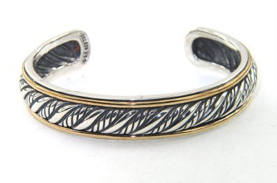 David Yurman 18K Yellow Gold & Silver Bangle: David Yurman 18K Yellow Gold & Silver Bangle.Bangle's Weight : 34 grams.The measurements of the Bangle: 48 x 38 mm and 11 mm wide.There is Stamp D.Y, 750, 925 on it.