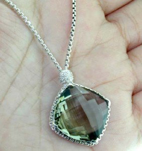 David Yurman Silver Smoky Topaz Diamond Necklace.: David Yurman Silver Smoky Topaz Diamond Necklace.The total weight of Necklace is 14.5 grams.The size of the smoky Topaz is 25 mm in diameter.Total weight of diamond are 0.3 cts, approximately, I color