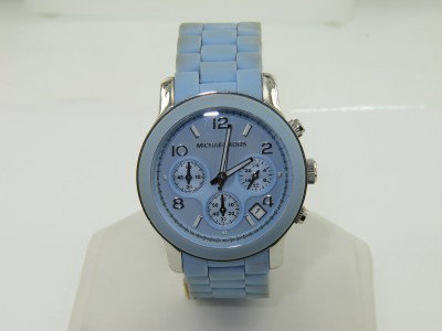 Michael Kors Stainless Steel Rubber Strap Watch: Michael Kors Stainless Steel Chronograph Rubber Strap Watch.Watch's Weight: 118.1 grams.The measurements of watch head: 38 x 38 mm and 12 mm in thickness.The length of watch: 8".Water Resistant.Swiss 