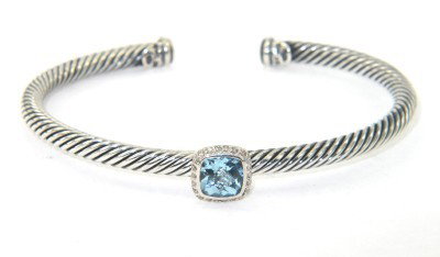 David Yurman Silver Blue Topaz & Diamond Bangle: David Yurman Silver Blue Topaz & Diamond Bangle The total Bangle's weight is 16.9 grams. The total weight of diamond: 0.22 cts. I color SI clarity The measurement of blue topaz: 6 x 6 mm The bangle si