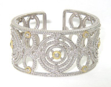 Judith Ripka Silver/18K Yellow Gold Diamond Bangle: Judith Ripka Silver/18K Yellow Gold Diamond Bangle The total weight of Bangle is 79.8 grams. The total weight of diamond is 0.36 cts. approximately, H color VS clarity. The size of Bangle: 53 x 43 mm 