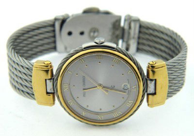 Philippe Charriol Stainless Steel/14K Gold Bangle W: Philippe Charriol Stainless Steel/14K Yellow Gold Bangle Watch. The total watch's weight is 59 grams.The size of the watch head is 31 x 31 mm and 5 mm thick.The measurements of inside watch: 47 x 58 m