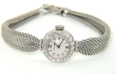 Movado 14K White Gold Diamond Watch: Movado 14K White Gold Diamond Watch.The total watch's weight is 17 grams.The total weight of diamond: 1.2 cts. H color VS clarity.The measurements of the watch head is 14 x 14 mm and 4 mm thick.The le