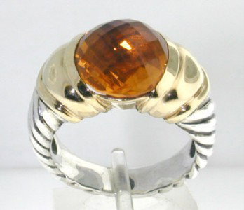 David Yurman Silver / 18K Yellow Gold, Citrine : David Yurman Silver / 18K Yellow Gold,Citrine Ring. The total ring's weight is 10 grams. The size of the Citrine is 12 mm in diameter. The measurement f ring's surface is 12 x 19 mm and 10 mm thick. T
