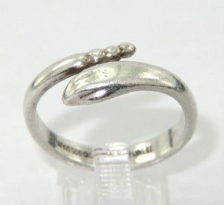 Tiffany & Co Silver Ring: Tiffany & Co Silver Ring.The total earring's weight is 4.1 grams.The size of ring: 8 and 2 mm wide