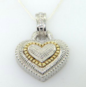 Judith Ripka Silver/ 18K Yellow Gold Pendant: Judith Ripka Silver/18K Yellow Gold Pendant With Pouch.The total Pendant weight is 7.5 grams.Size of pendant: 19 x 16 mm.The pendant is 17 mm wide and 3 mm in thickness
