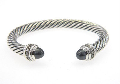 David Yurman Silver Hematite & Diamond Bangle: David Yurman Silver Hematite & Diamond Bangle.The total Bangle's weight is 44.5 grams.The total diamond weight is 0.48 cts approximately, I color SI clarity.The size of the Hematite is 6 mm, each.The