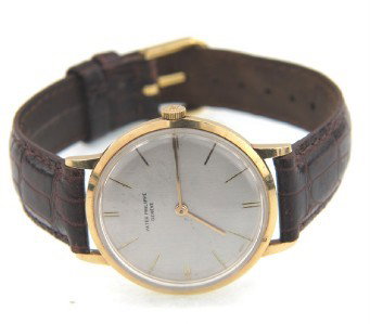 Patek Philippe 18K Yellow Gold Leather Strap Watc: Patek Philippe 18K Yellow Gold Leather Strap Watch.The total watch's weight is 30 grams.The measurements of watch head is 31 x 32 mm and 7 mm thick.Dial: Gold Stick dial.Movement: Manual.The length of