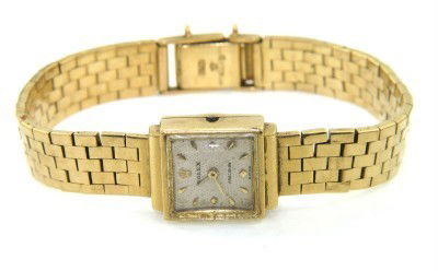 Rolex 18K Yellow Gold Wrist Watch: Rolex 18K Yellow Gold Wrist Watch The total watch's weight is 30.4 grams. The measurements of watch head is 12 x 12 mm and 4 mm thick. The length of watch: 6.25" swiss made Water Resistant Chain is 8