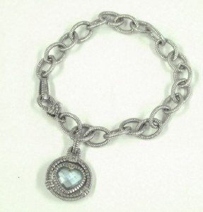 Judith Ripka 18K Gold/Silver, Blue Quartz Bra: Judith Ripka 18K Yellow Gold / Silver, Blue Quartz Bracelet.The total weight of Bracelet is 18.8 grams.The measurements of Blue Quartz: 9 x 9 mm.The measurement of bracelet: 6.5" long