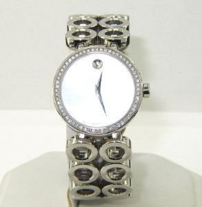 Movado Stainless Steel Diamond Watch: Movado Stainless Steel Diamond Watch.The total watch's weight is 76.2 grams.The total weight of diamond: 0.5 cts. I color SI clarity.The measurements of the watch head is 29 x 29 mm and 5 mm thick.The