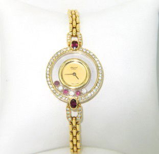 Chopard 18K Yellow Gold Happy Diamond Ruby Watc: Chopard 18K Yellow Gold Happy Diamond Ruby Watch.Watch's Weight : 30.2 grams.Total weight of diamond: 1.5 cts. approximately, G color, VS clarity.Total weight of Ruby is 1.6 ct. appriximately.The meas