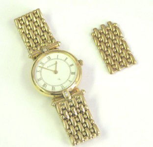 Bucherer 18K Yellow Gold, Diamond Watch.: Bucherer 18K Yellow Gold, Diamond Watch with extra link.Watch's Weight : 35.7 grams.The length of watch: 3.75".The total weight of diamond: 0.06 pts. H color VS clarity.Swiss made.Water resistant.Chia