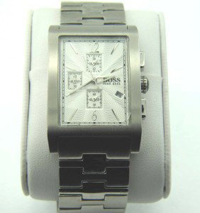 Hugo Boss Stainless Steel Chronograph Watch: Hugo Boss Stainless Steel, Chronograph Watch with Box.The total watch's weight is 138.3 grams.The measurements of the watch head is 30 x 38 mm in and 11 mm in thick.The length of watch: 7.75".Chain is