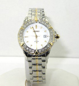 Seiko Stainless Steel, Tow-Toned Date: Seiko Stainless Steel, Two-Toned, Mother of Pearl Date Quartz Watch.The total watch's weight is 68 grams.The measurements of the watch head is 30 mm in diameter and 8 mm in thick.The length of watch: 