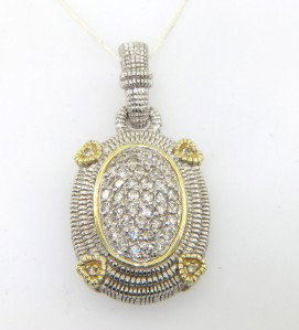 Judith Ripka Silver/ 18K Yellow Gold Dia: Judith Ripka Silver/18K Yellow Gold Diamond Pendant The total Pendant weight is 11.2 grams. The total weight of diamond: 0.86 cts. H color VS clarity Size of pendant: 26 x 16 mm The pendant is 16 mm w