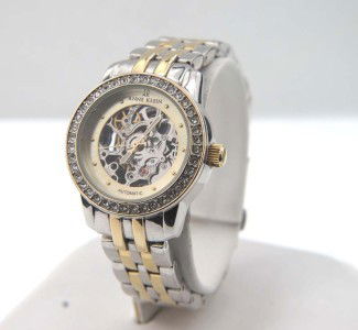 Anne Klein Stainless Steel Skeleton Automatic Watch: Anne Klein Stainless Steel Skeleton Automatic Watch.The total watch's weight is 70.3 grams.The measurements of the watch head is 27 x 27 mm and 11 mm in thick.The length of watch: 6.25".Water Resistan