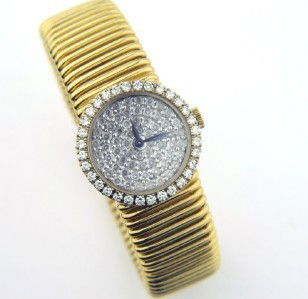 Piaget 18K Yellow Gold, Diamond Watch: Piaget 18K Yellow Gold, Diamond Watch The total watch's weight is 60.8 grams. The total weight of diamond: 2 cts. H color VS clarity The measurements of watch head is 21 x 21 mm and 4 mm thick. The le