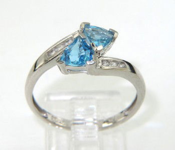 10K White Gold Blue Topaz, Diamond Ring: 10K White Gold Blue Topaz, Diamond Ring.The total ring's weight is 2 grams.The size of Topaz: 5 x 5 mm.Total weight of diamond: 0.06 pts , I color, SI clarity.The size of ring's face: 7 x 7 mm and 3 m