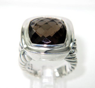 David Yurman Silver Smoky Topaz Ring: David Yurman Smoky Topaz Ring in Silver.The total ring's weight is 16.3 grams.The size of smoky topaz is 12 x12 mm.The measurement of ring's surface: 18 x 18 mm and 6 mm in thickness.The size of the r