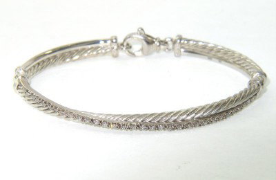 David Yurman Silver, Diamond Bangle: David Yurman Silver, Diamond Bangle.Bangle's Weight: 14.3 grams.Total diamonds weight: 0.49 cts, I color, SI-1 clarity.The measurements of the inside Bangle: 53 x 41 mm.There is Stampe "D.Y 925"